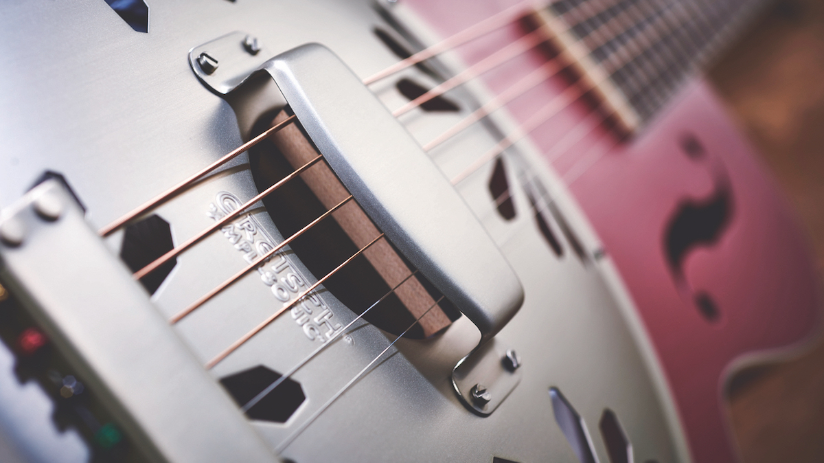 Close of up body of red Gretsch resonator guitar